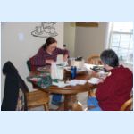 03 Janet Wallace & Corry Weaver working on checks.jpg